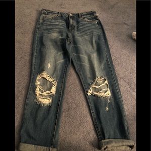 Dark distressed blue jeans